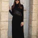 פאוץ' מעור מטקסטורת נחש בצבע שחור עם רוכסני מתכת